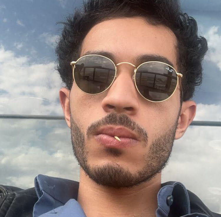 a man with sunglasses and beard